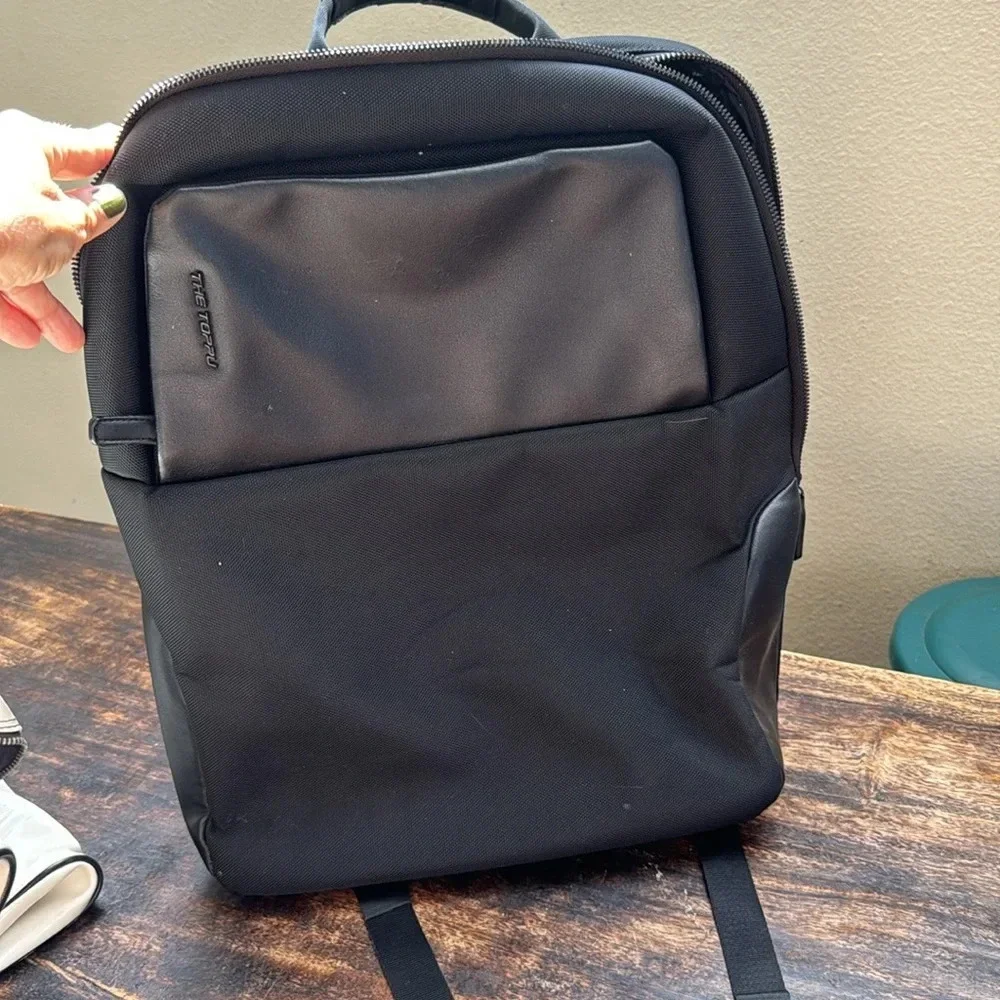 The Toppu black backpack minimalist sleek design unisex